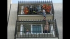 Boy dangling from balcony rescued