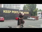 Unicycling Darth Vader plays Star Wars theme on flaming bagpipes