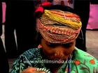Woman wearing tribal jewelry at Dilli haat